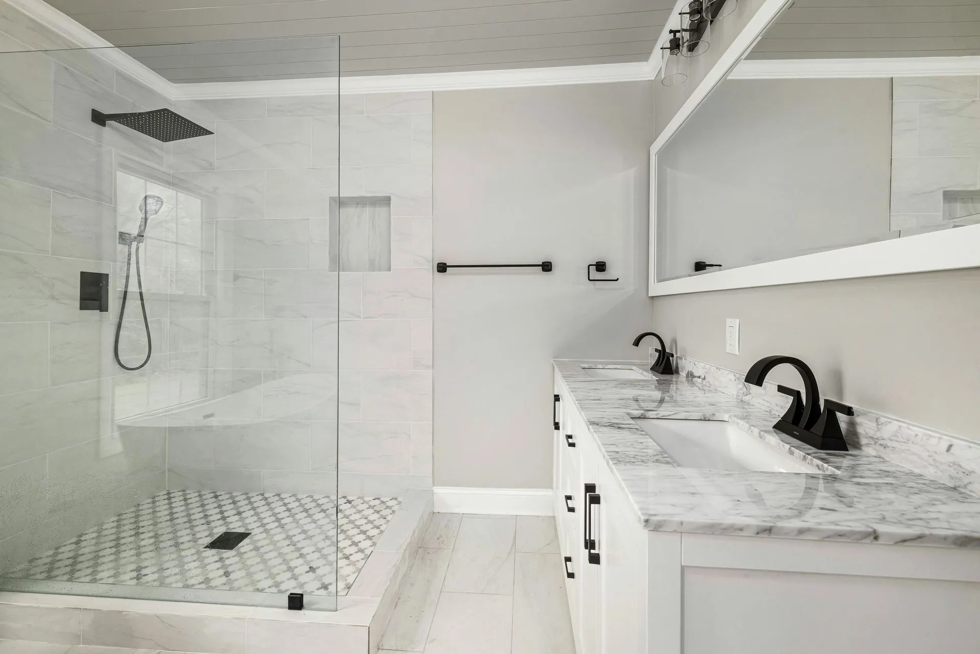 Modern bathroom with glass shower and double vanity